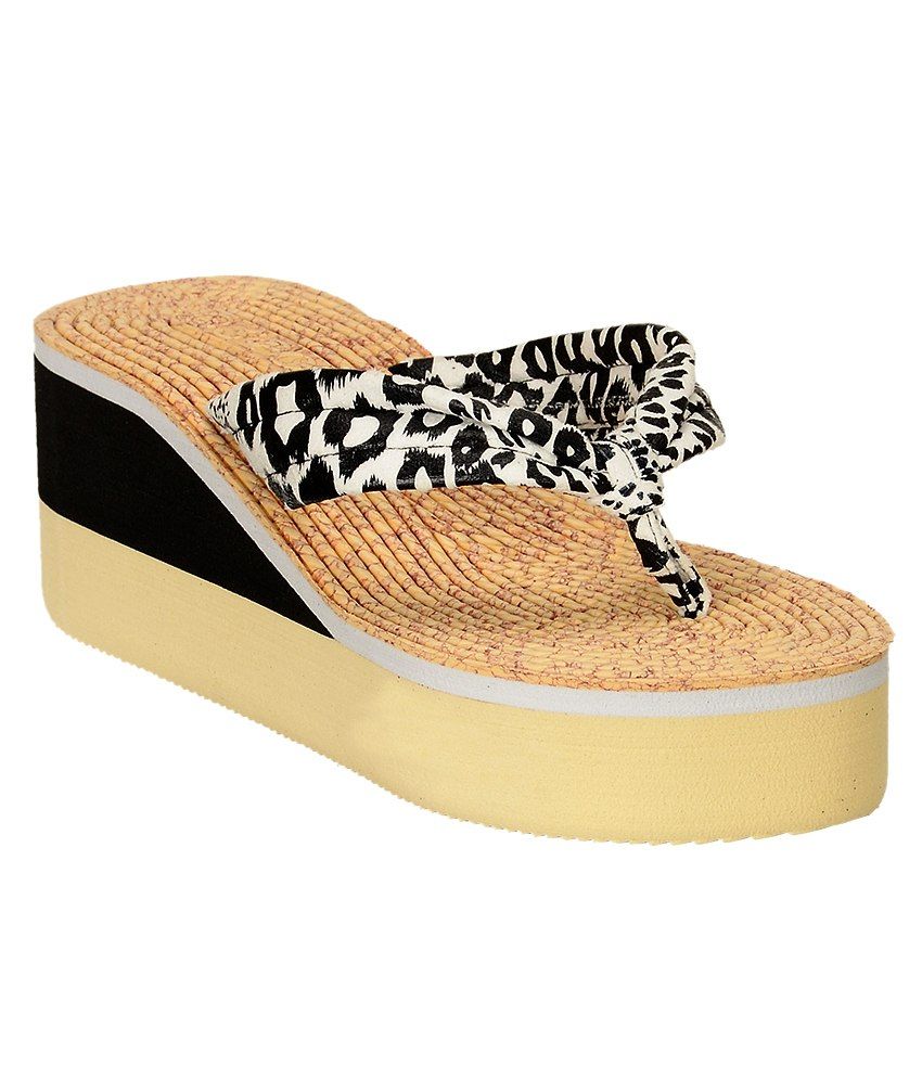 tan and black flip flops