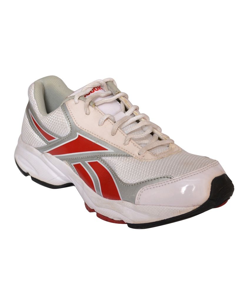 white and red reeboks