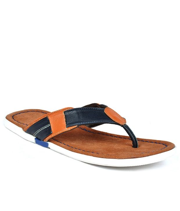 tan flip flops with black straps
