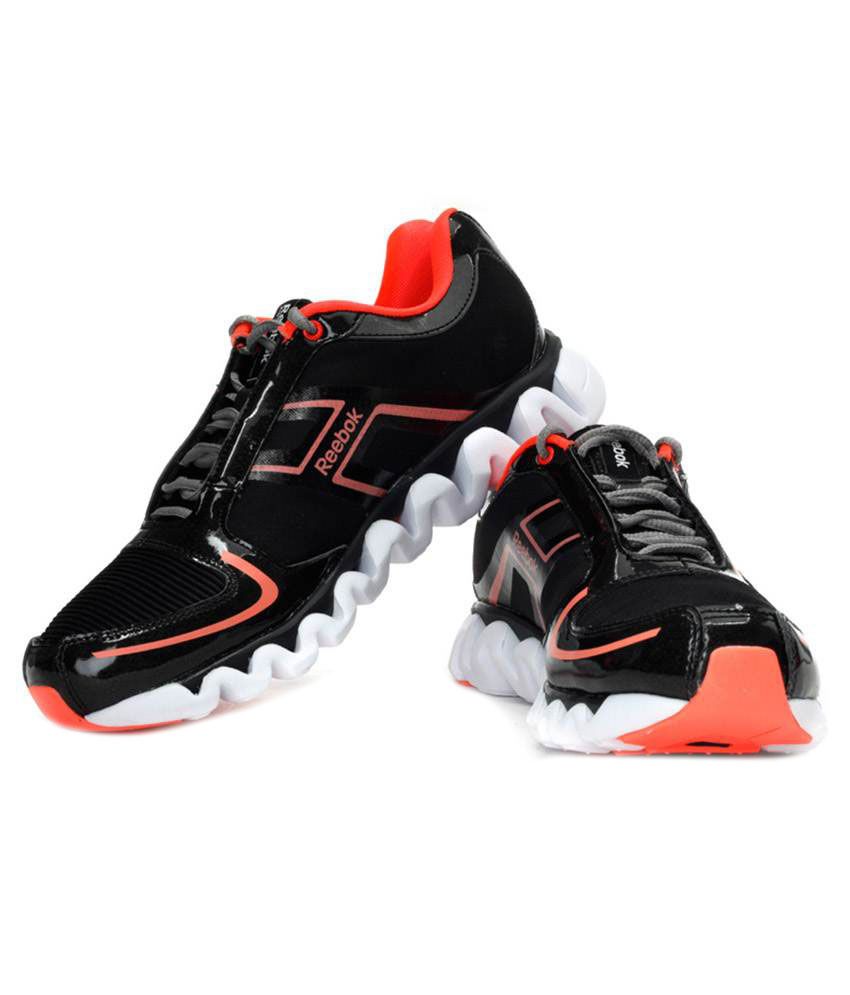 orange reebok trainers