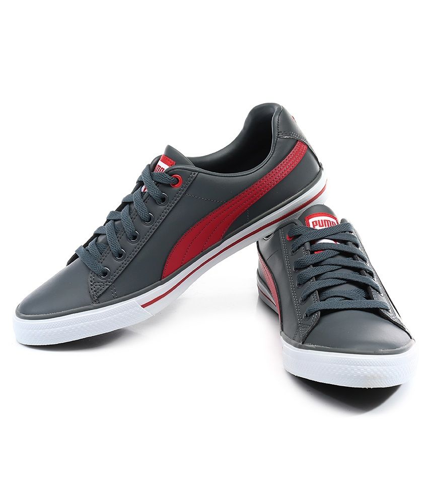 grey and red puma shoes