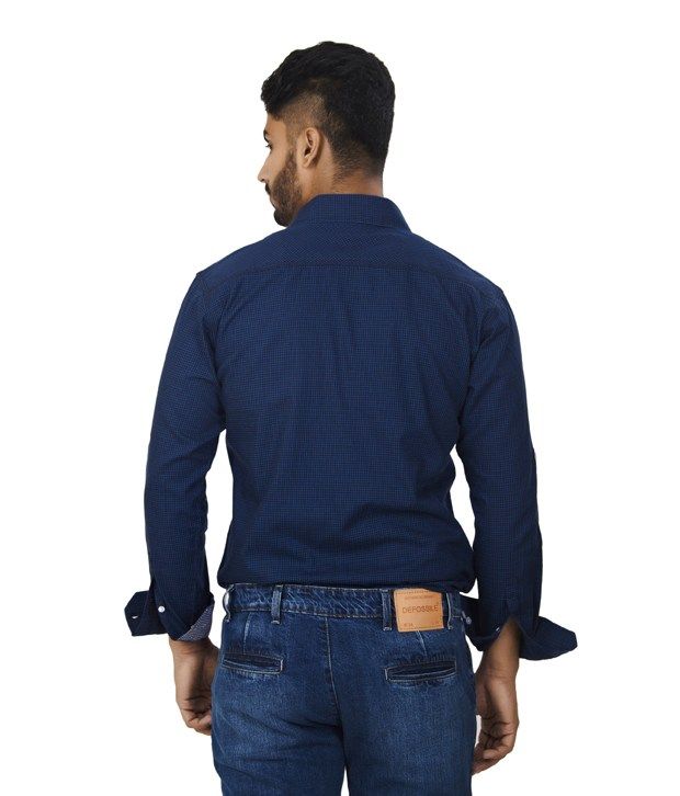 blue check shirt with black pants