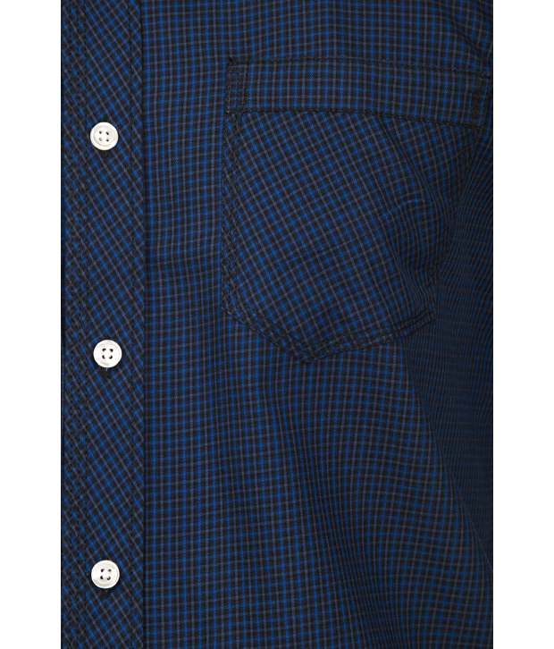 blue check shirt with black pants
