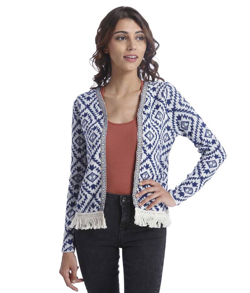 white knotted sweater