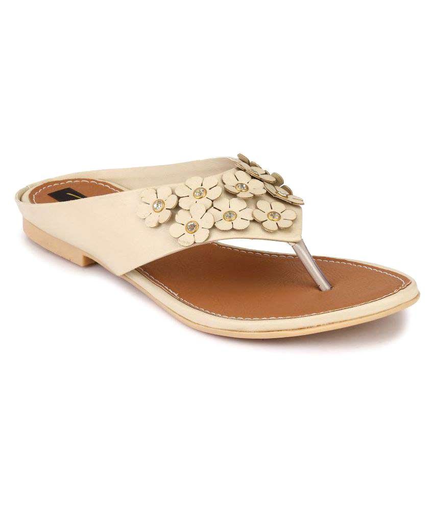 beige flats with black tips