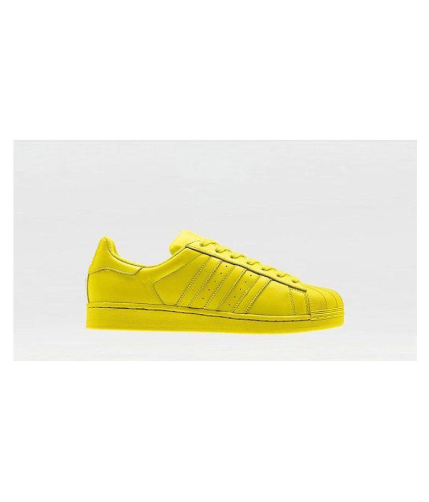 yellow adidas superstars