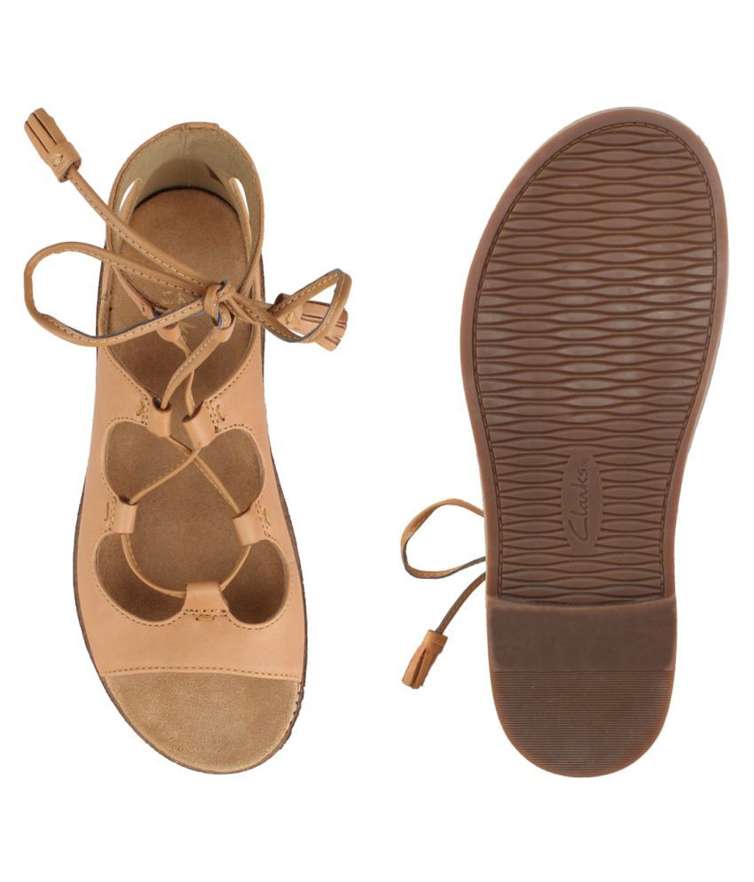 tan flats with black toe