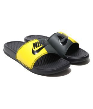 yellow nike flip flops