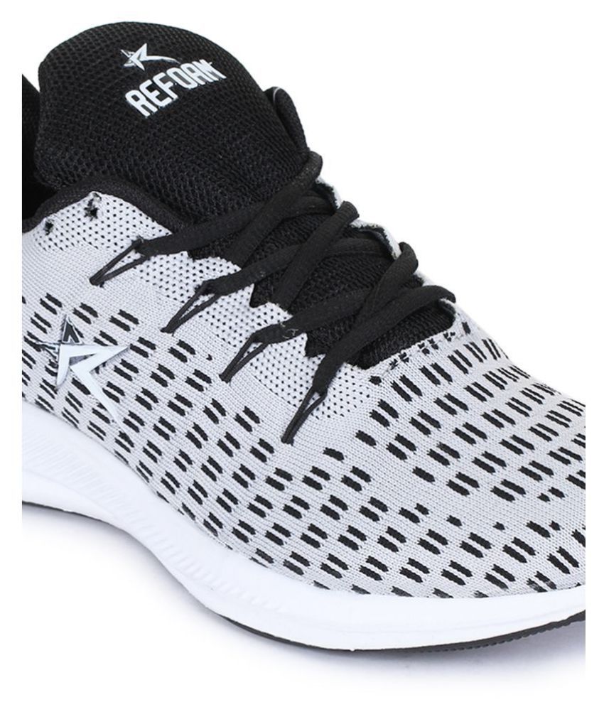 white canvas running shoes